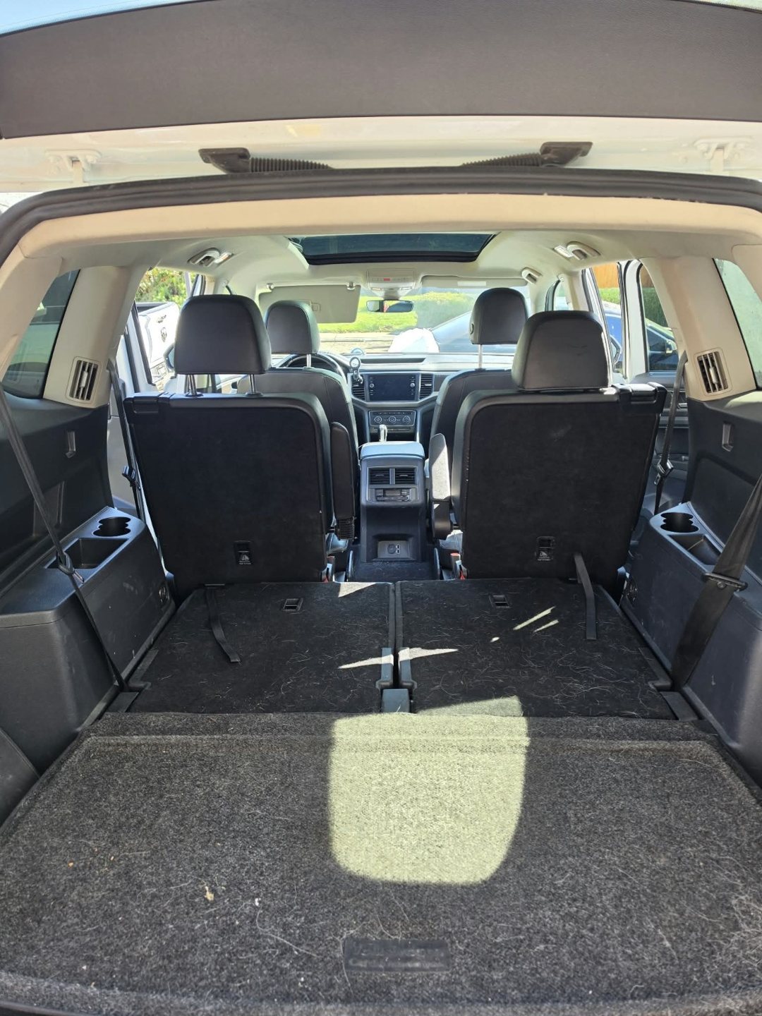 Volkswagen Atlas cargo carpet with pet hair and debris before interior restoration